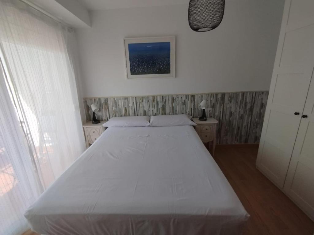 Posteľ alebo postele v izbe v ubytovaní Apartamento Victoria Plaza