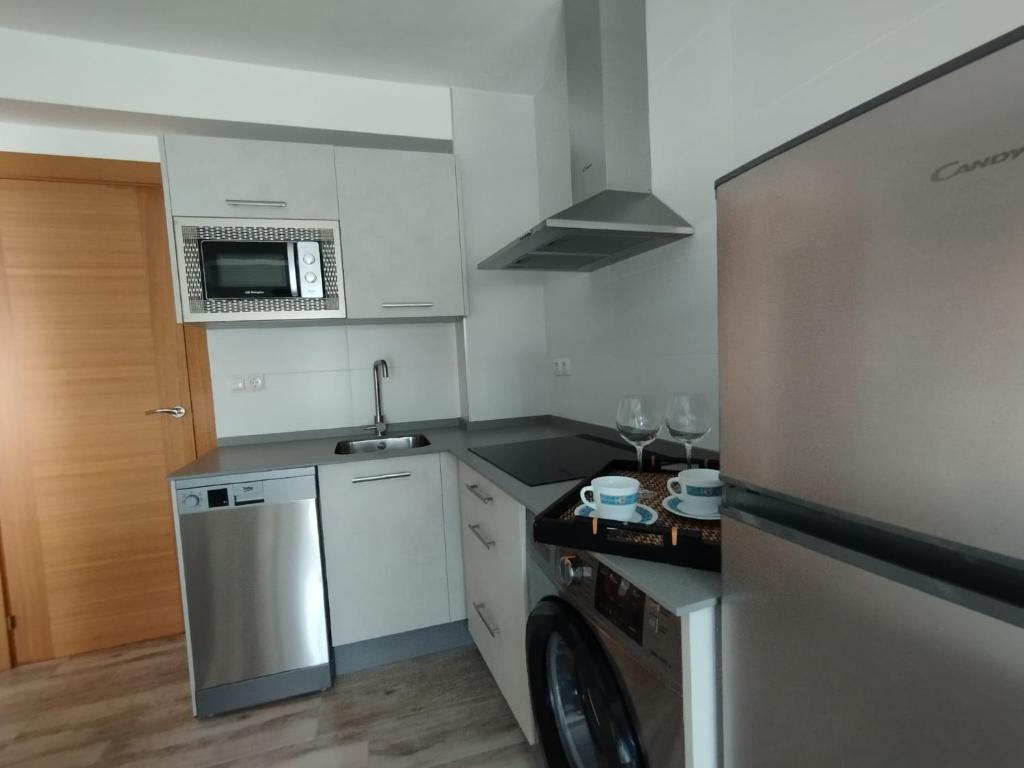 Kuchyňa alebo kuchynka v ubytovaní Apartamento Victoria Plaza