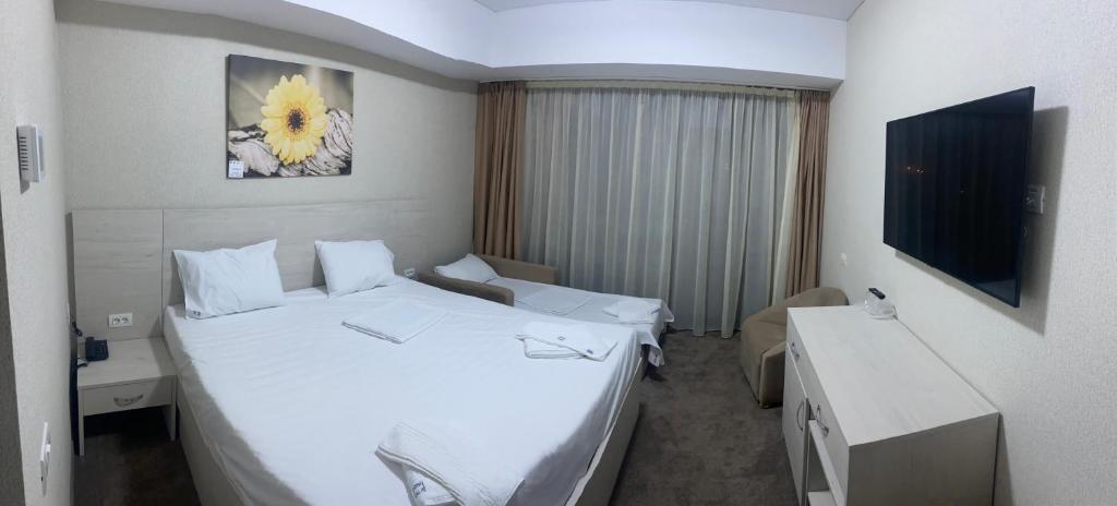 Postel nebo postele na pokoji v ubytování Hotel Alis