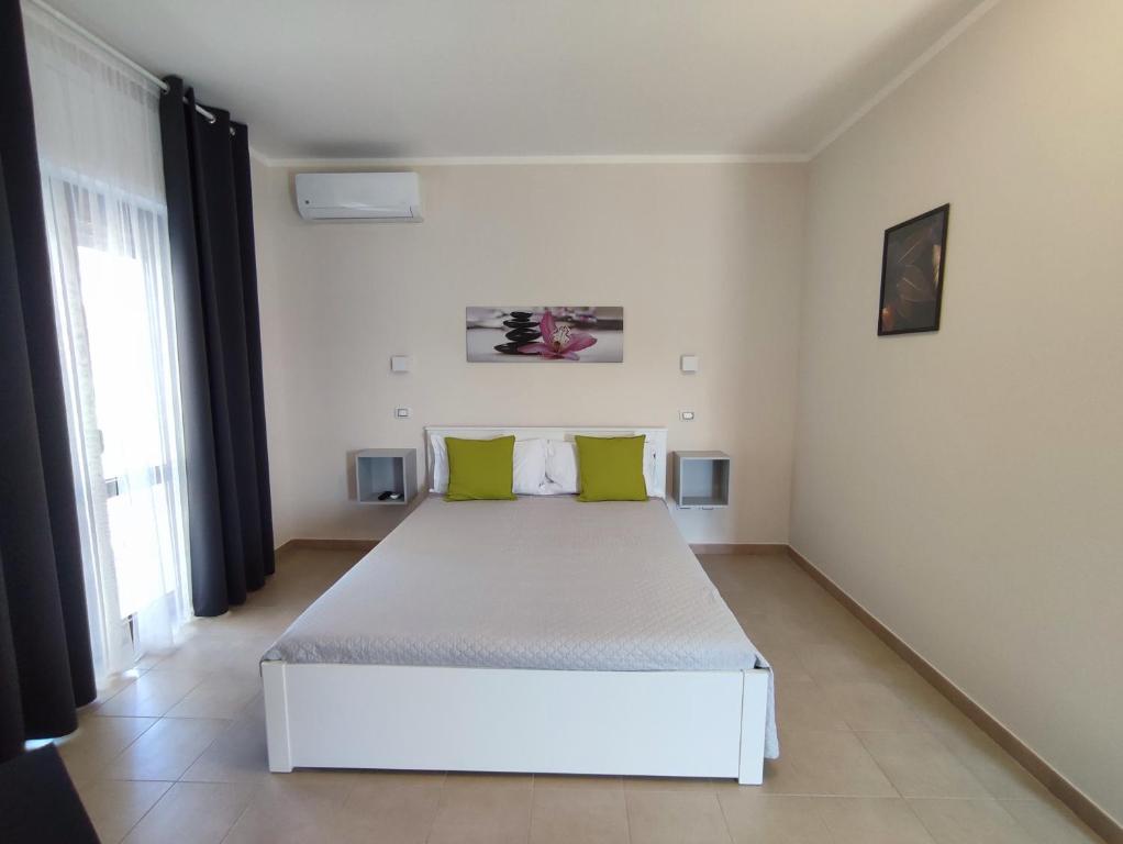 Posteľ alebo postele v izbe v ubytovaní Cristian Rooms