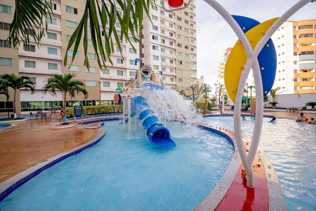 a water slide in a pool in a resort at Riviera Park in Caldas Novas