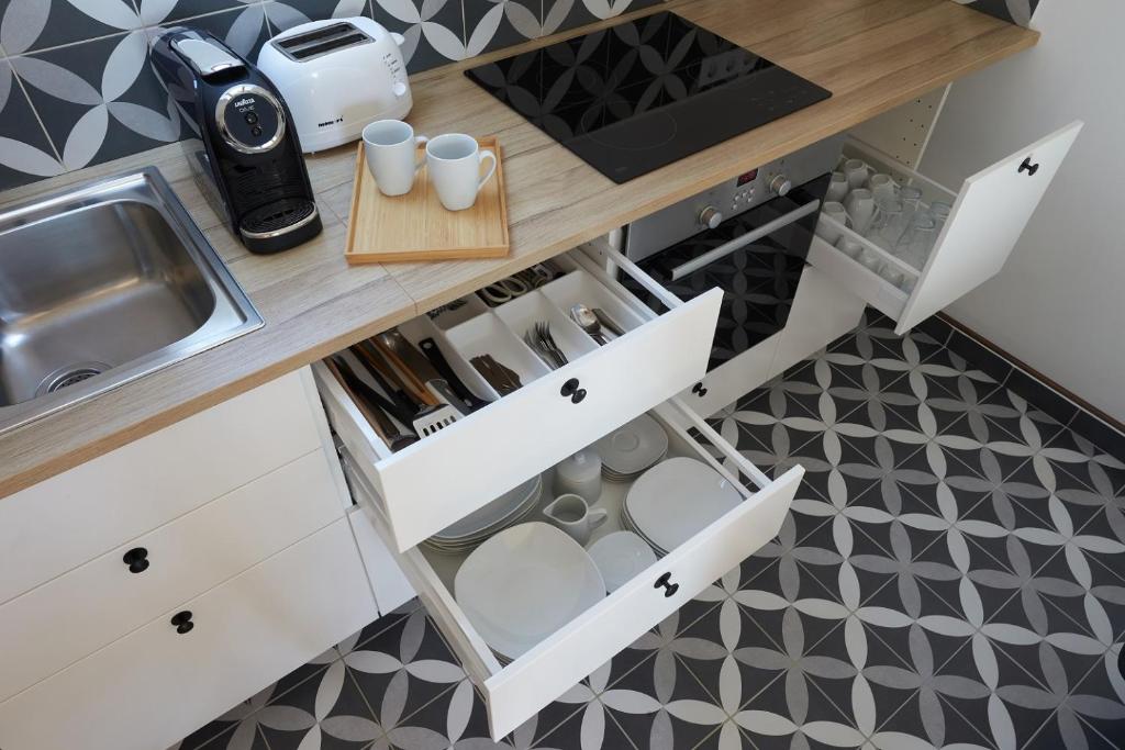 Kuchyň nebo kuchyňský kout v ubytování D4 Apartments Dörgicse