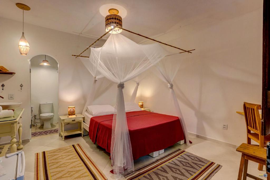 Cama ou camas em um quarto em Pousada Ilha Verde