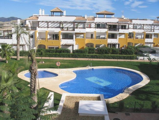 Bazén v ubytovaní Vera Playa 2 hab 2 WC parking AA, Wifi, padel piscina climatizada y verano Lomas de mar alebo v jeho blízkosti