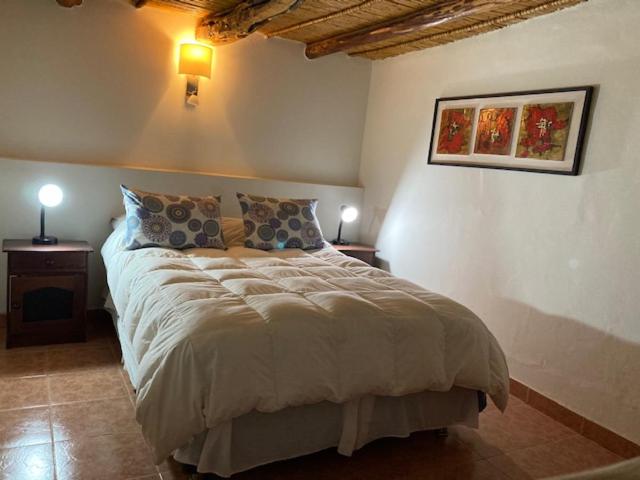 Postel nebo postele na pokoji v ubytování Hostal Puritama