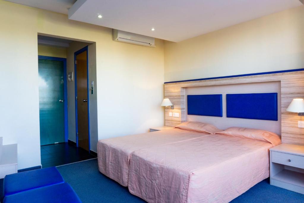 Postel nebo postele na pokoji v ubytování Mariandy Hotel