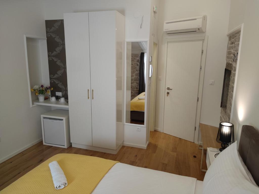 Posteľ alebo postele v izbe v ubytovaní S-Rooms