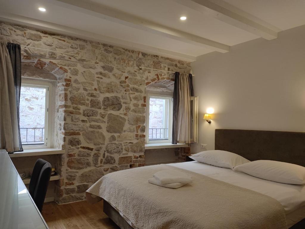 Posteľ alebo postele v izbe v ubytovaní S-Rooms