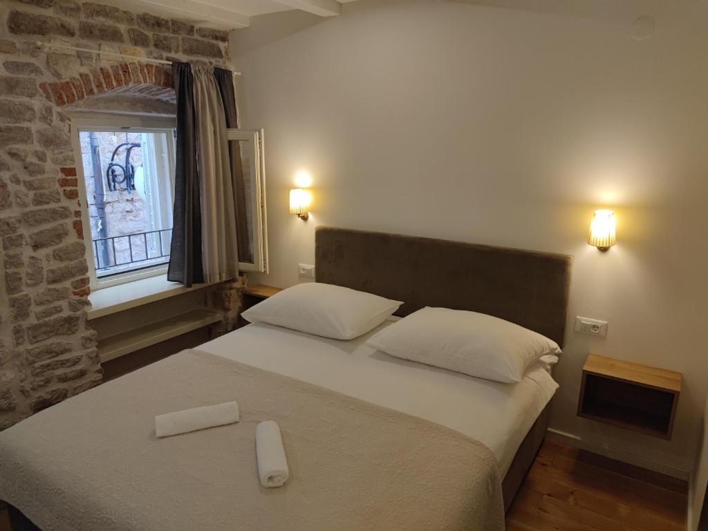Posteľ alebo postele v izbe v ubytovaní S-Rooms