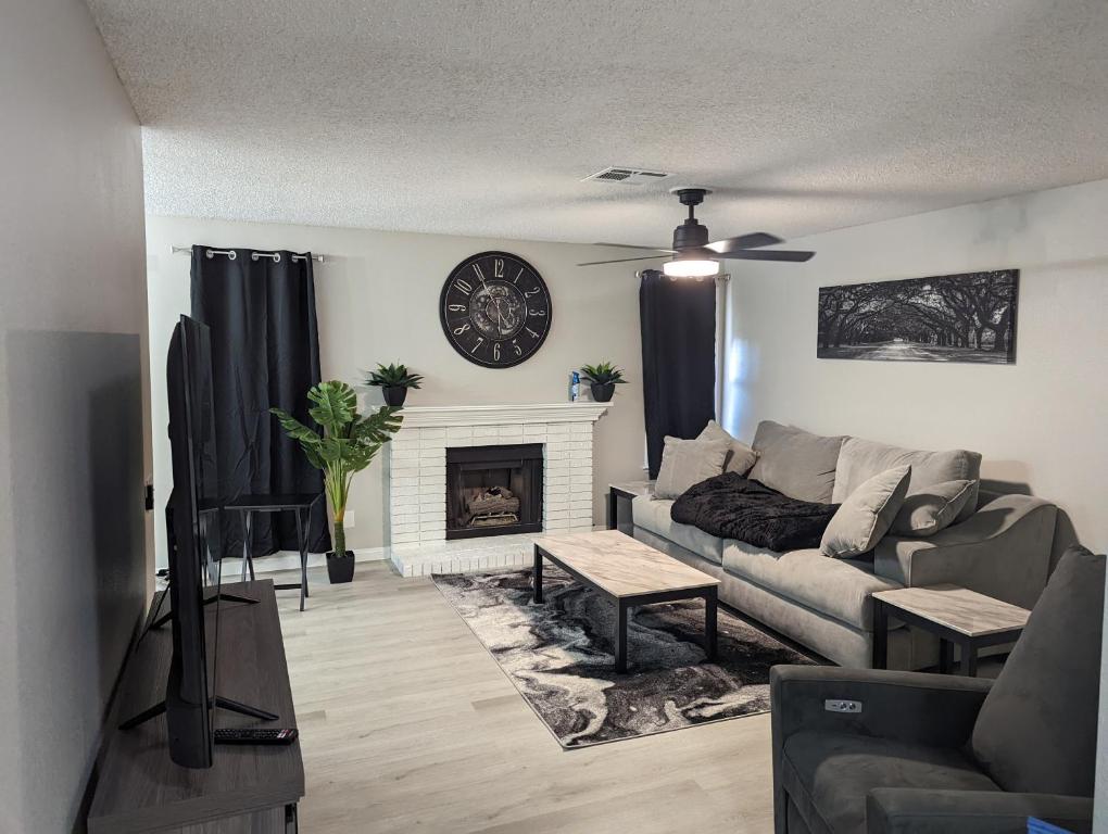 a living room with a couch and a fireplace at Casa Mesa Villas in Las Vegas