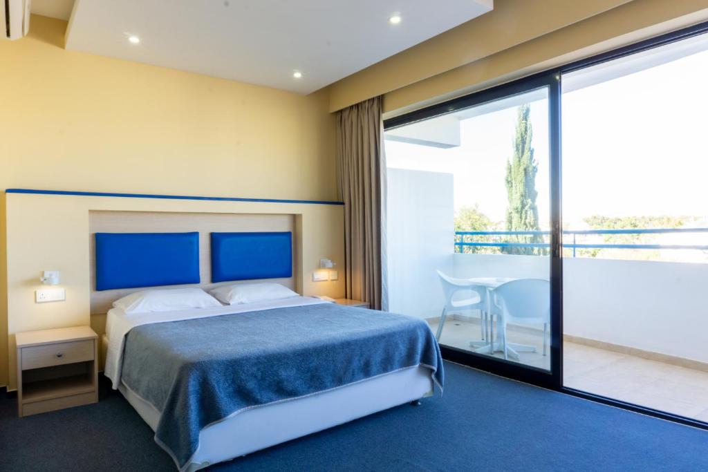 Postel nebo postele na pokoji v ubytování Mariandy Hotel