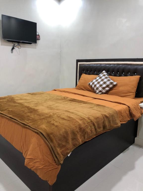 Postel nebo postele na pokoji v ubytování Guest house Cemara