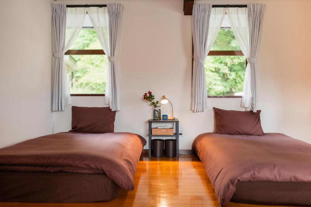 Postel nebo postele na pokoji v ubytování R-house 1st