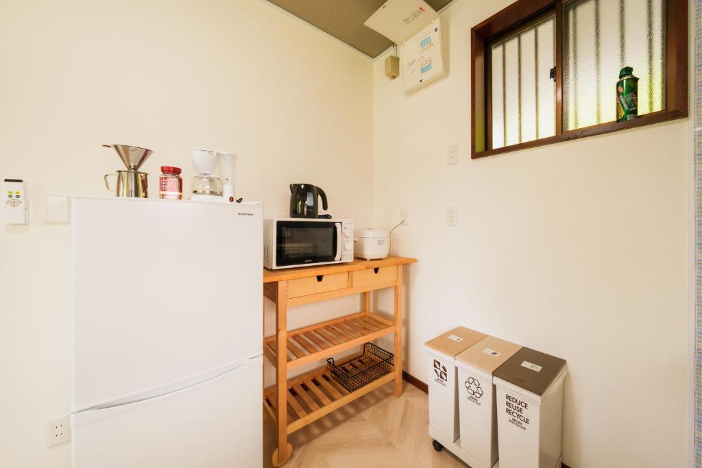Kuchyň nebo kuchyňský kout v ubytování R-house 1st