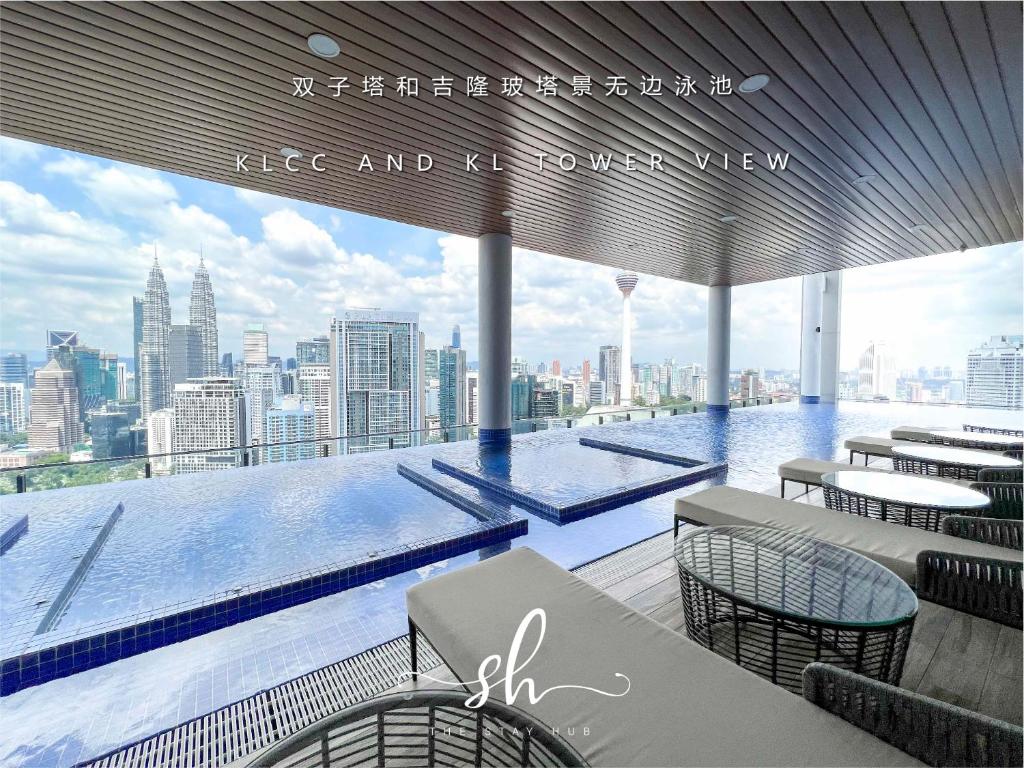 a swimming pool on the top of a building at The Luxe KLCC View Sky Pool in Kuala Lumpur