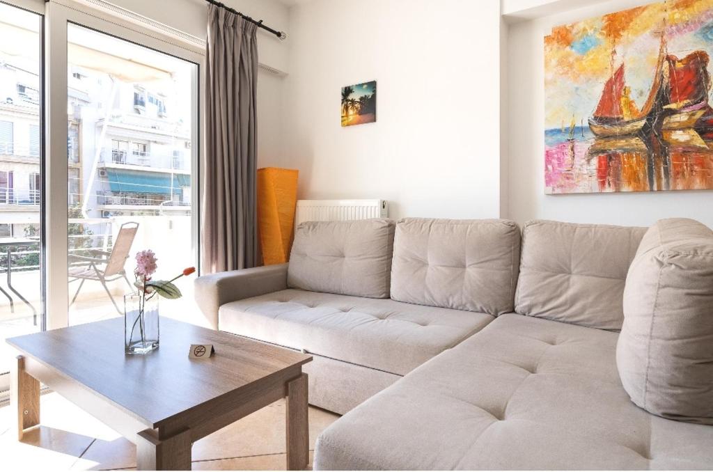 a living room with a couch and a table at "Athena 3" luxury's apartments in Athens !!! in Athens