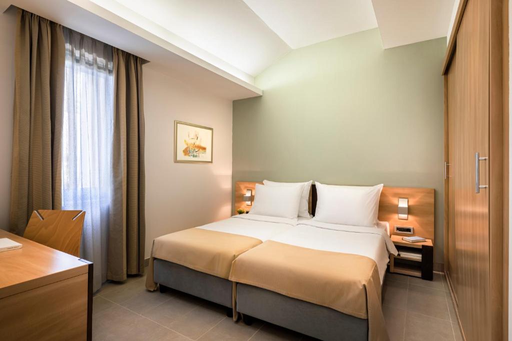 Ein Bett oder Betten in einem Zimmer der Unterkunft Maistra Select Petalon Resort