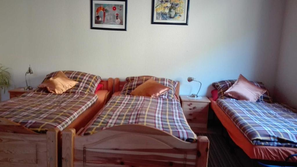 two beds sitting next to each other in a bedroom at Haus am Bach in Freiburg im Breisgau