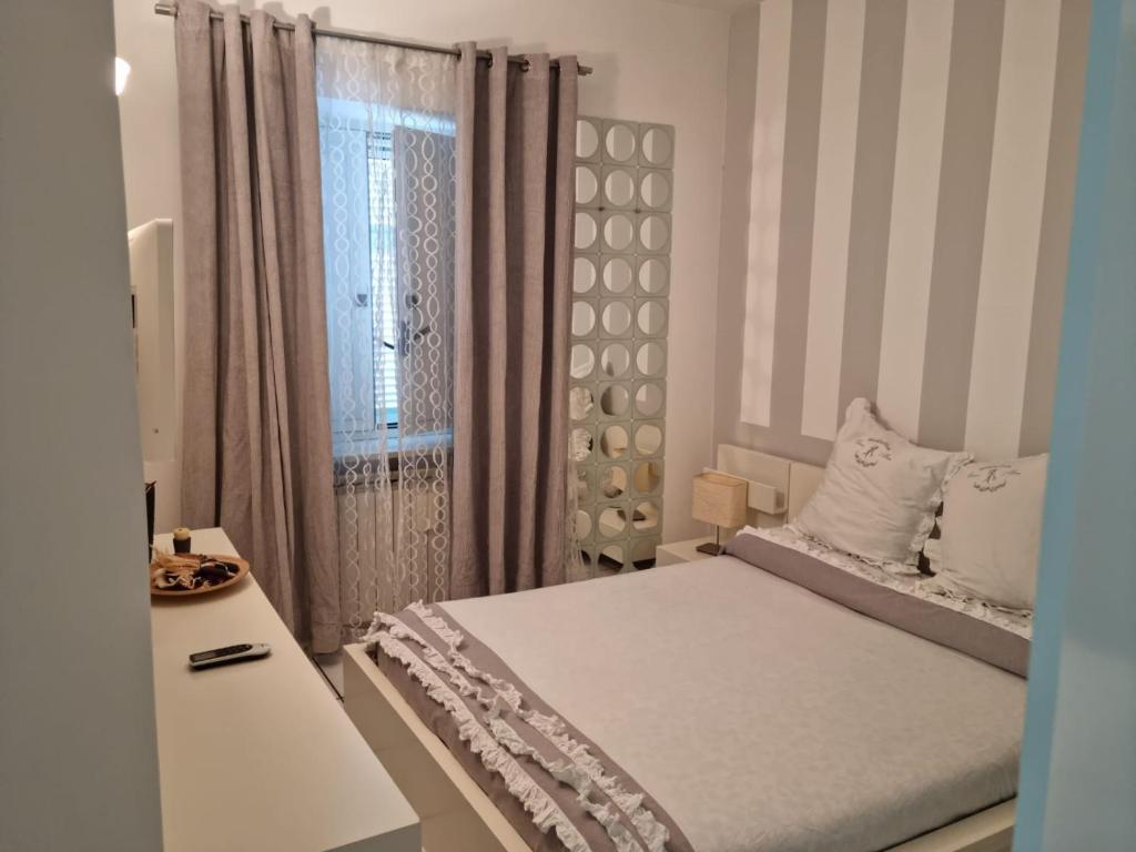 Rúm í herbergi á La Cameretta