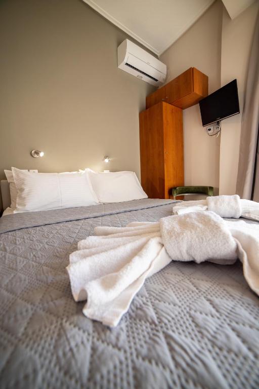 Postel nebo postele na pokoji v ubytování Hotel Galaxy
