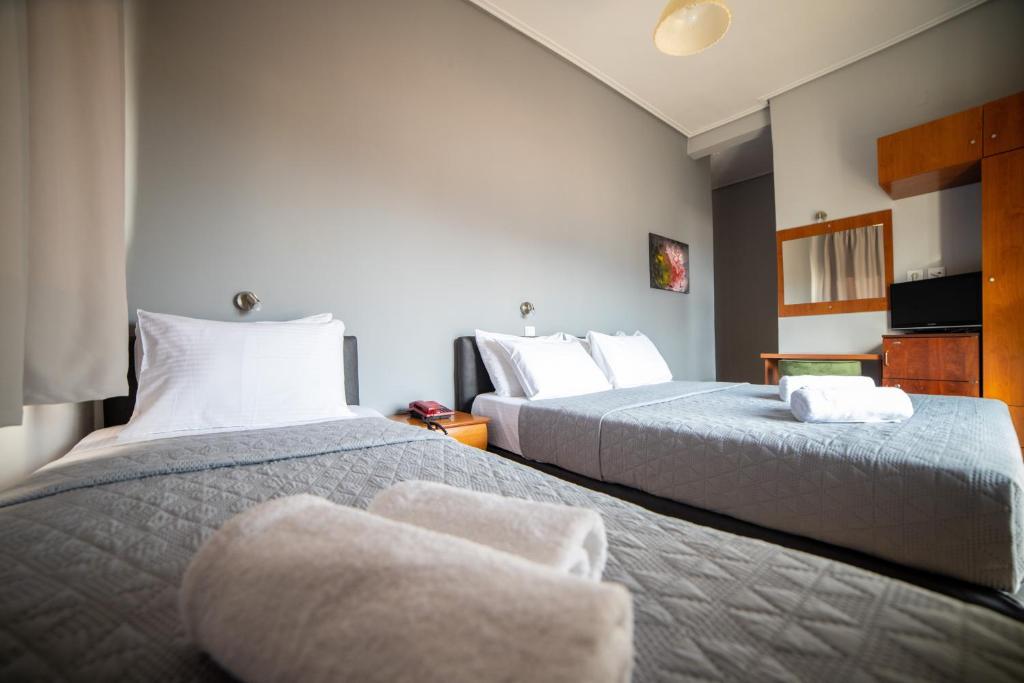 Postel nebo postele na pokoji v ubytování Hotel Galaxy