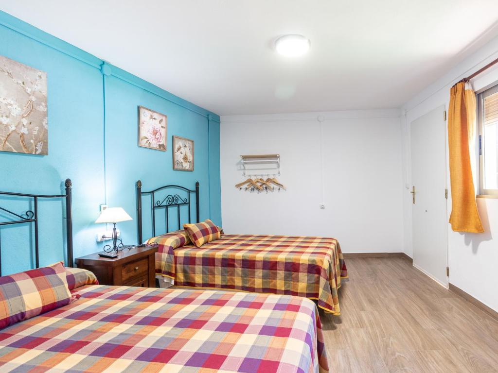 Postel nebo postele na pokoji v ubytování Cortijo la erilla