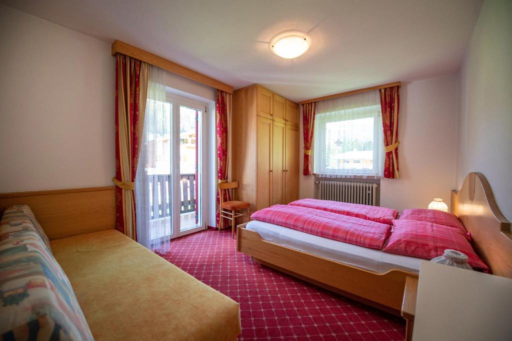 Łóżko lub łóżka w pokoju w obiekcie Apartments Seida