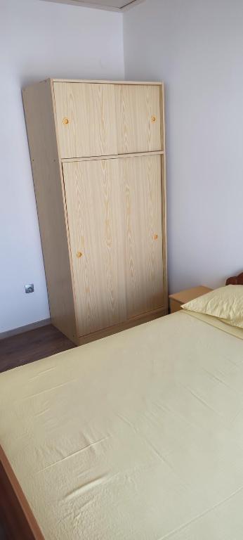 Posteľ alebo postele v izbe v ubytovaní Apartmani Ivka