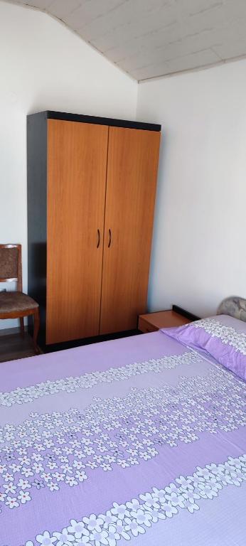 Posteľ alebo postele v izbe v ubytovaní Apartmani Ivka