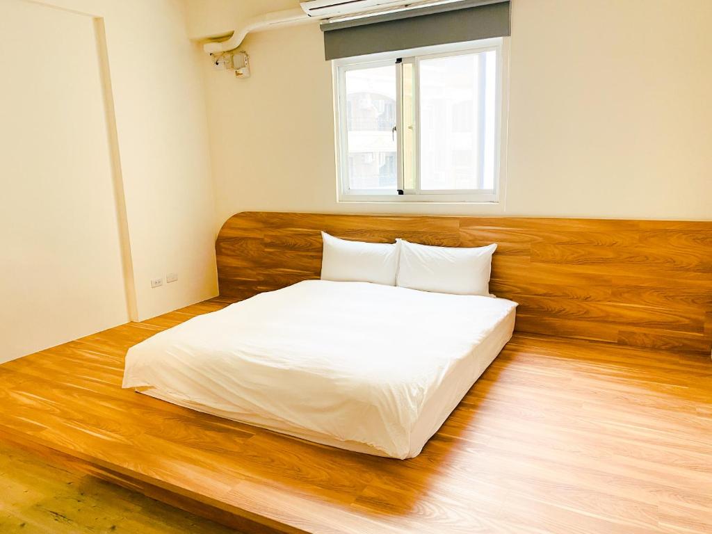 Postel nebo postele na pokoji v ubytování 艾睏khùn行旅