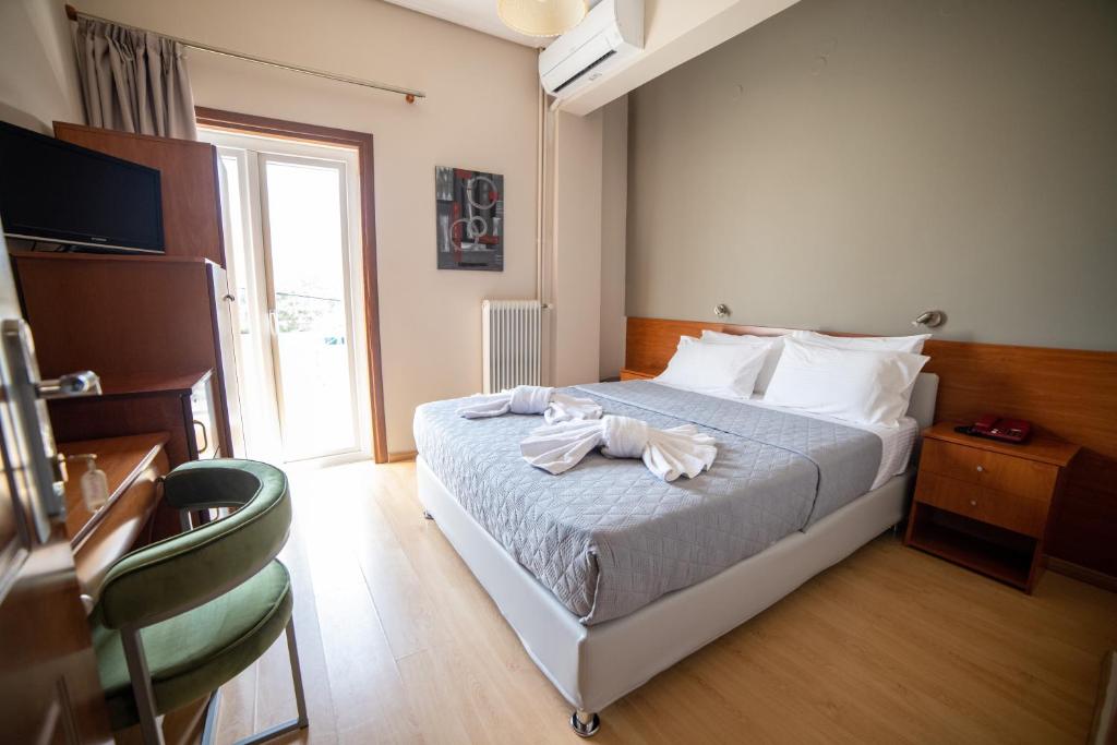 Postel nebo postele na pokoji v ubytování Hotel Galaxy
