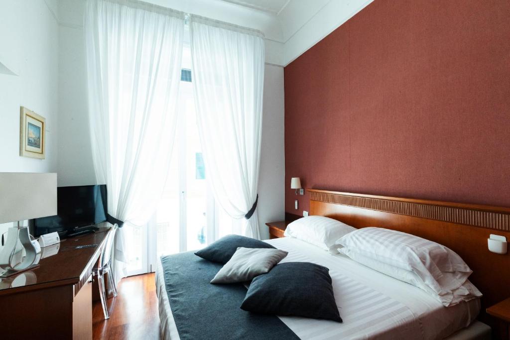 Postel nebo postele na pokoji v ubytování Rex Lifestyle Hotel