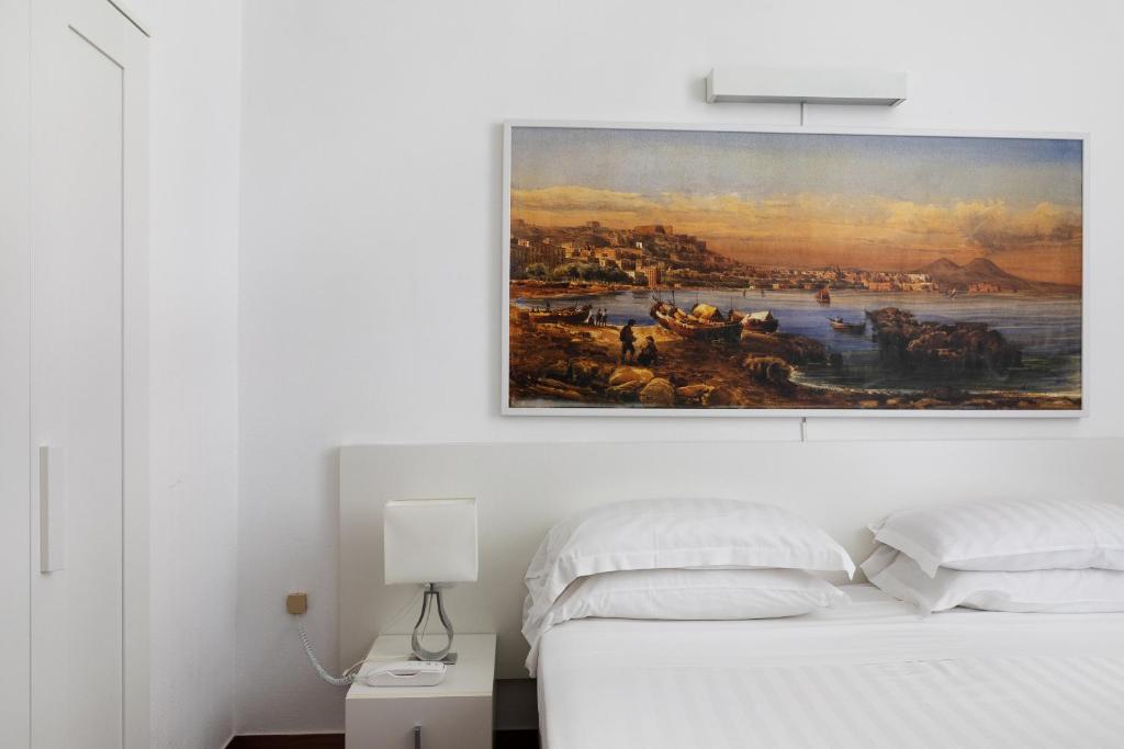 Postel nebo postele na pokoji v ubytování Rex Lifestyle Hotel