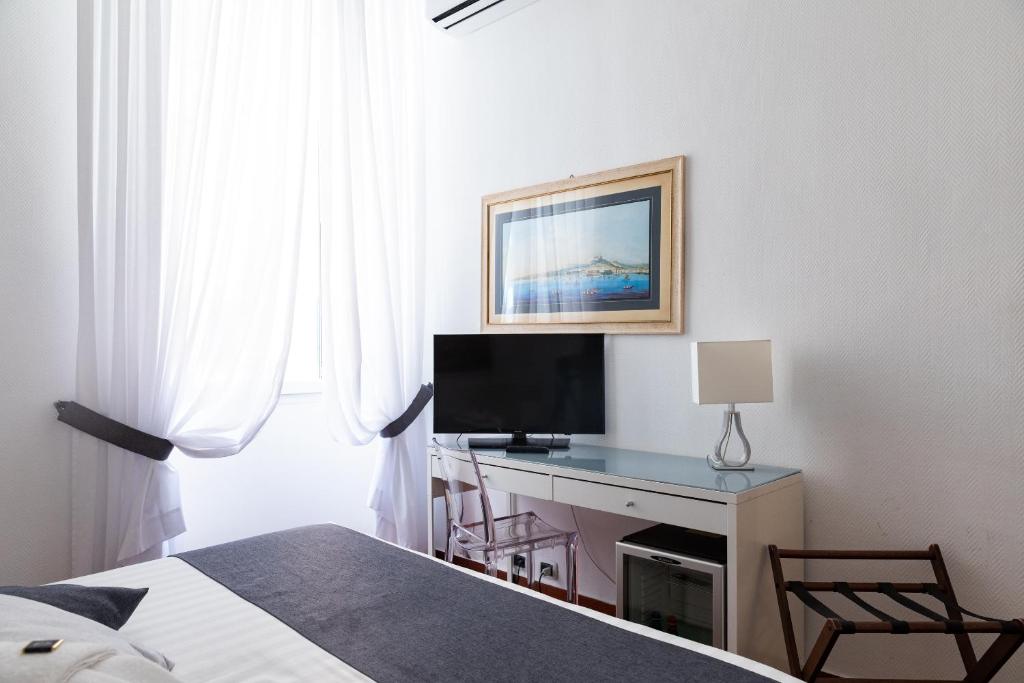 TV a/nebo společenská místnost v ubytování Rex Lifestyle Hotel