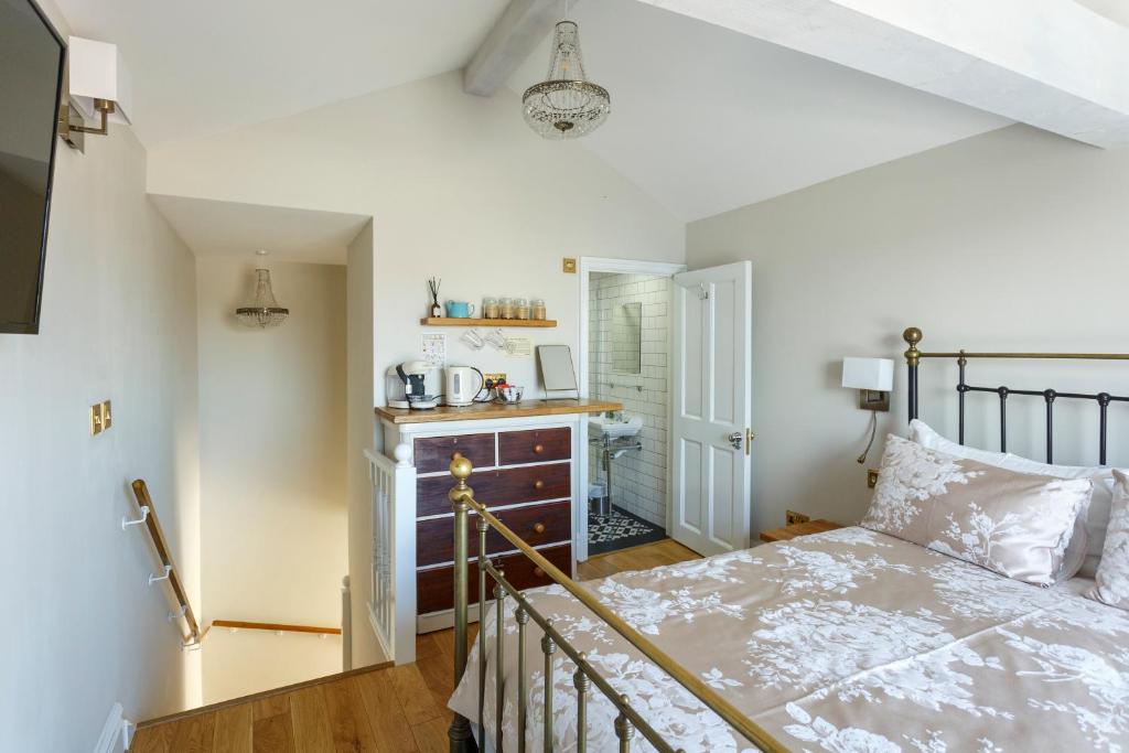 a bedroom with a bed and a desk at The Beetroot in Margate