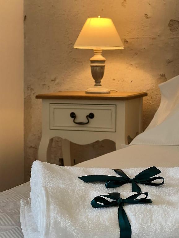 Posteľ alebo postele v izbe v ubytovaní B&B Donna Cinzia