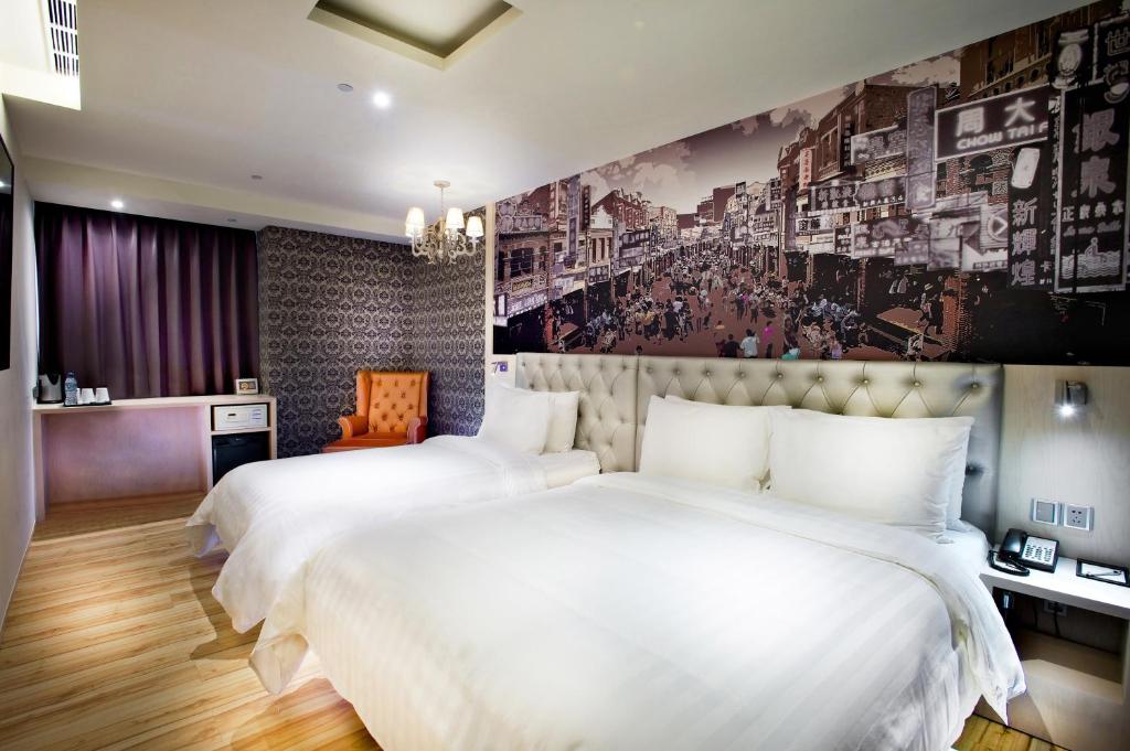 Postel nebo postele na pokoji v ubytování FX Hotel Tainan