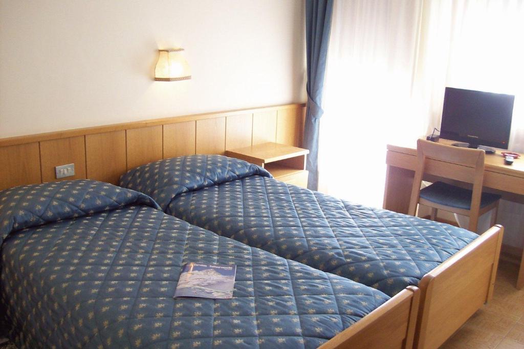 Postel nebo postele na pokoji v ubytování Punta Margherita