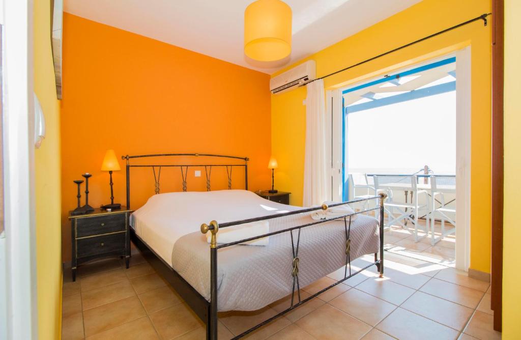 A bed or beds in a room at Laconian Collection ''Le Bleu Infini''