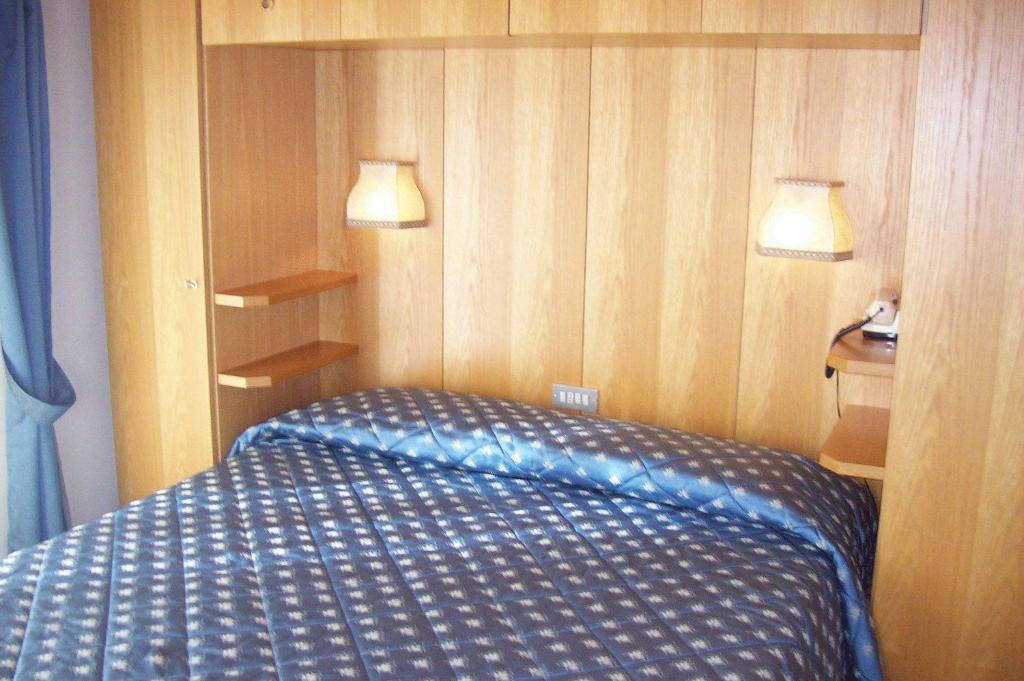 Postel nebo postele na pokoji v ubytování Punta Margherita