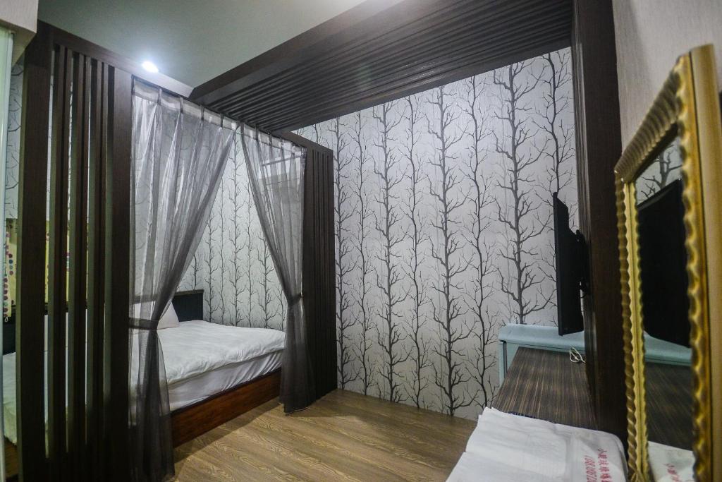 Postel nebo postele na pokoji v ubytování 綠蠵龜潛水住宿