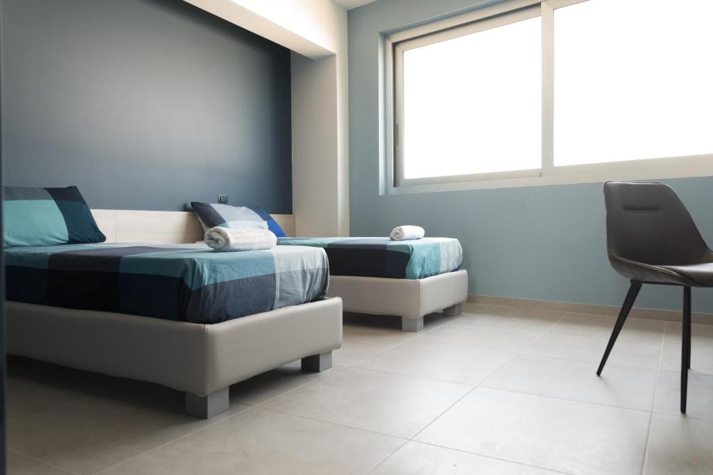 Posteľ alebo postele v izbe v ubytovaní Luna Nova Rooms