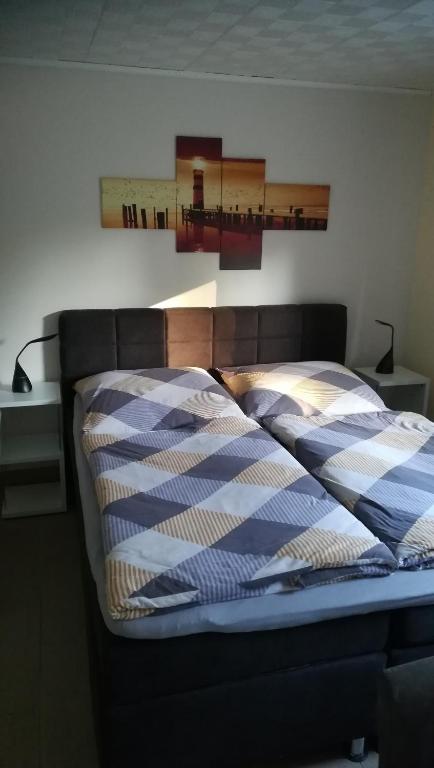 a bed with two pillows on it in a bedroom at Ferienwohnung Ahoi in Putbus
