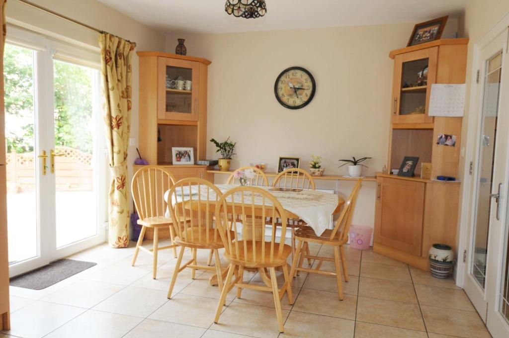 a kitchen and dining room with a table and chairs at slieve rushen in Derrylin