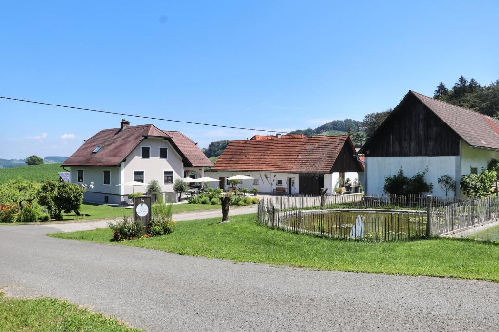 a winding road in a village with houses at Lackenbauer in Muggenau