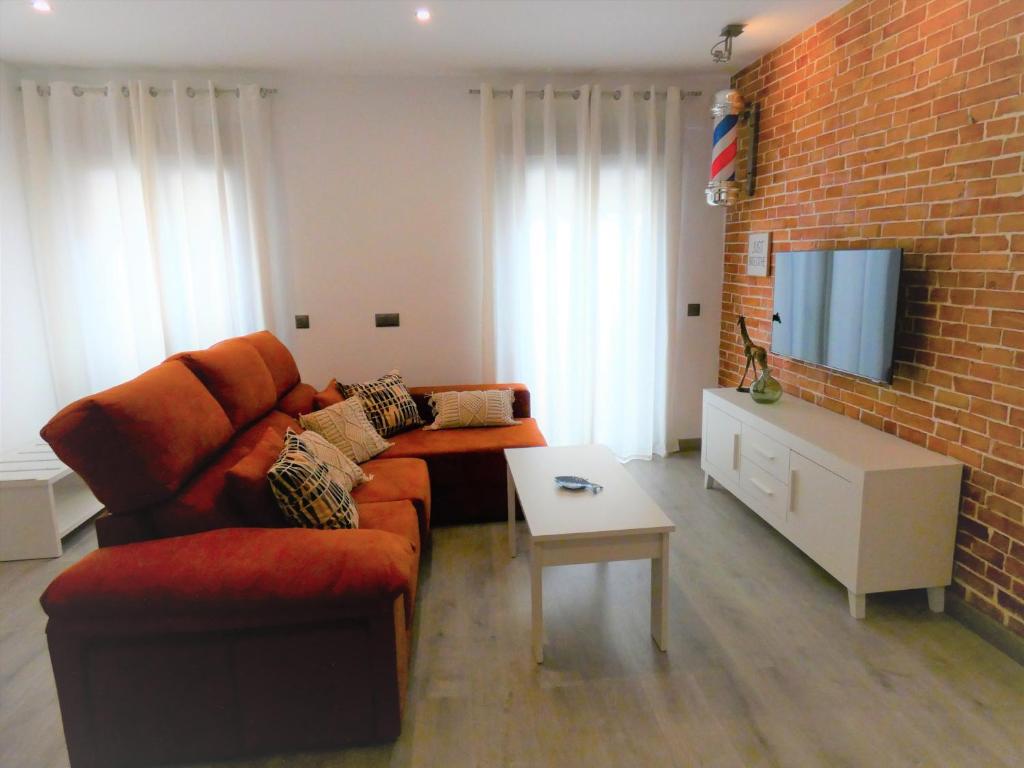 Televízia a/alebo spoločenská miestnosť v ubytovaní Casa Barbero