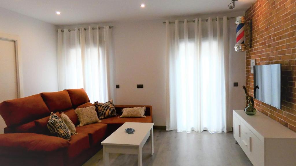 Televízia a/alebo spoločenská miestnosť v ubytovaní Casa Barbero