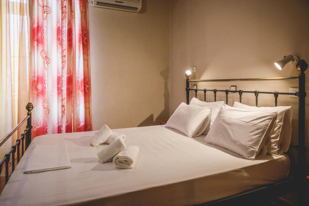 Postel nebo postele na pokoji v ubytování Hotel EPIDAVROS
