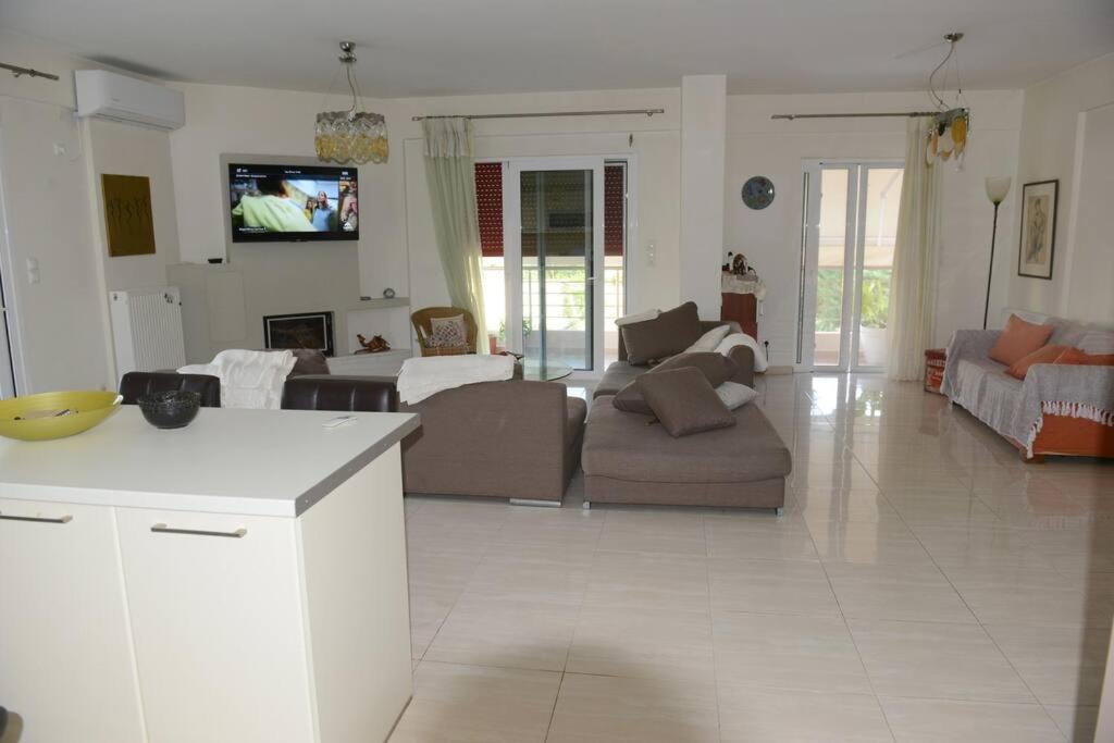 a large living room with a couch and a table at Ducky House in Preveza