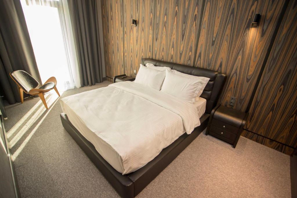 Postel nebo postele na pokoji v ubytování Gumbati Apart Hotel